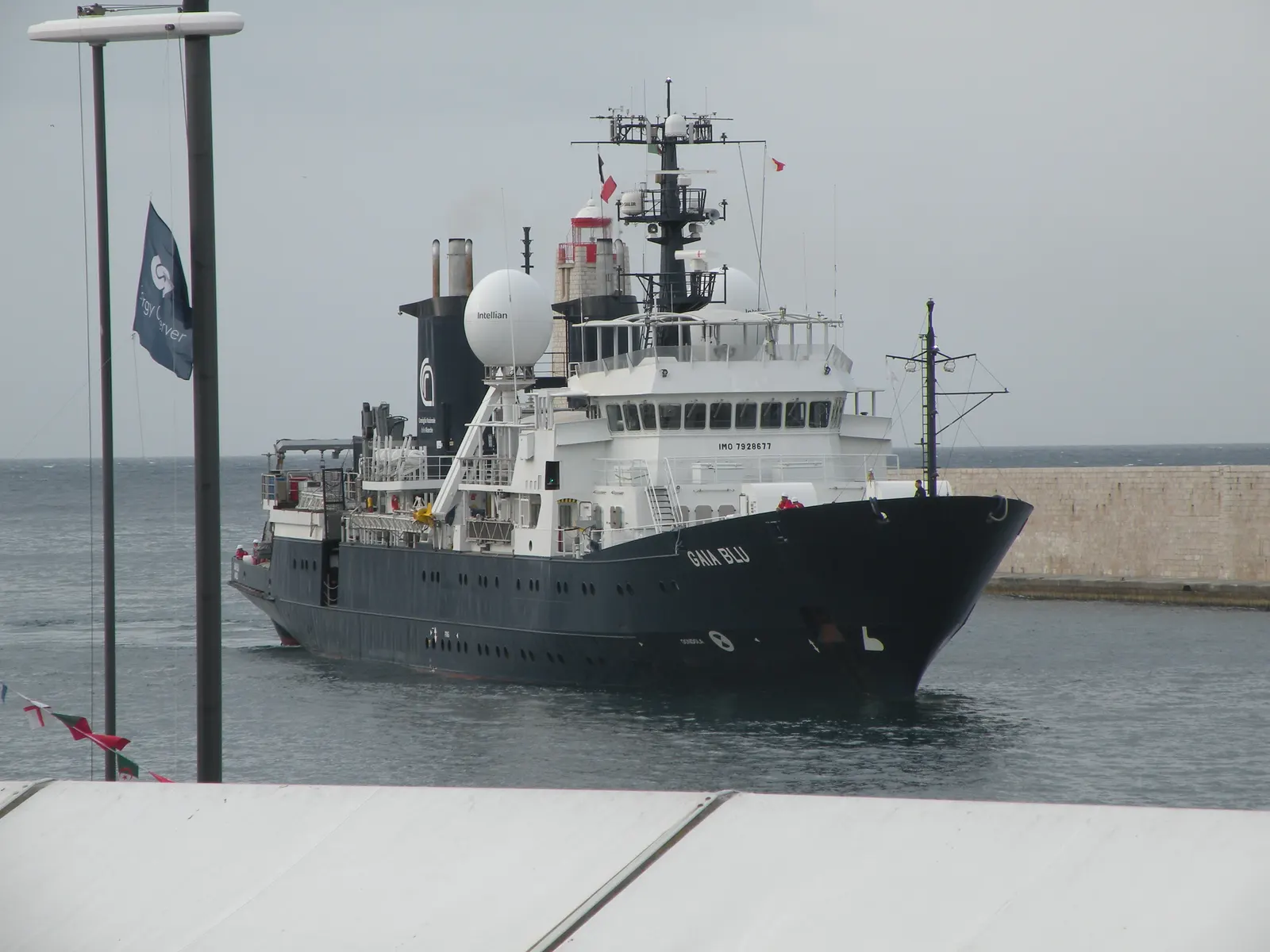 The research vessel Gaia Blu in Nice harbour, with a dark hull and white superstructure.