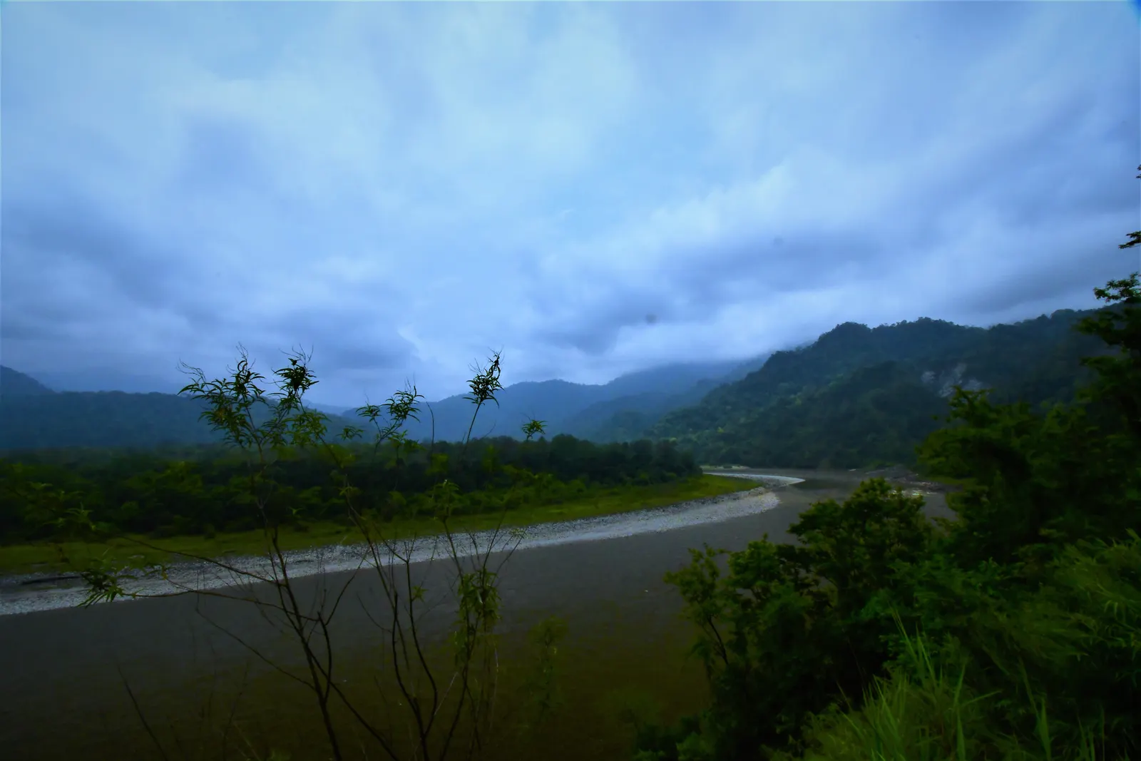 The Manas River between forested hills in Bhutan
