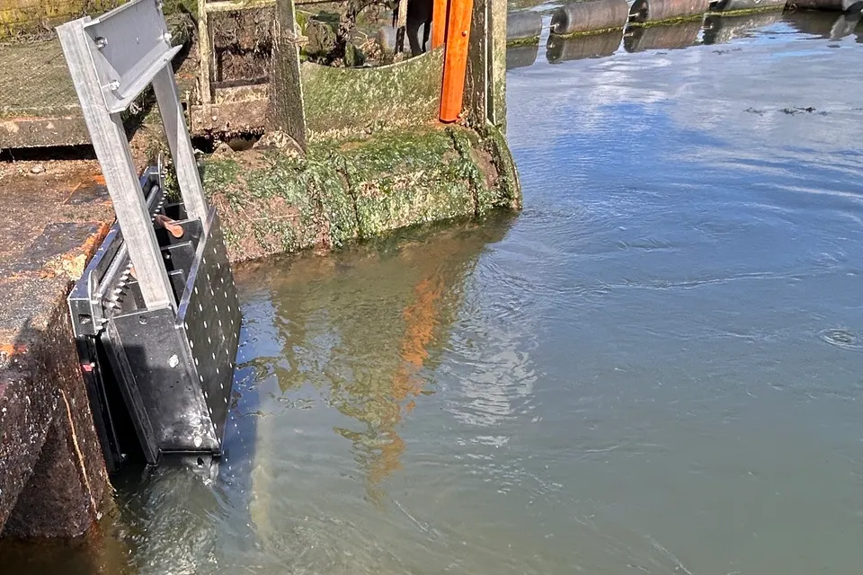 A new tidal outfall flap beside the water in Lymington’s flood defences.