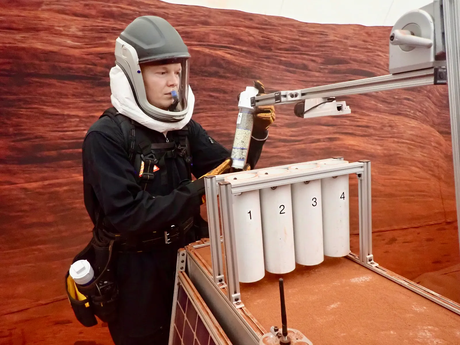 James Spicer performs a simulated geological activity in the CHAPEA environment in Houston, on Earth.