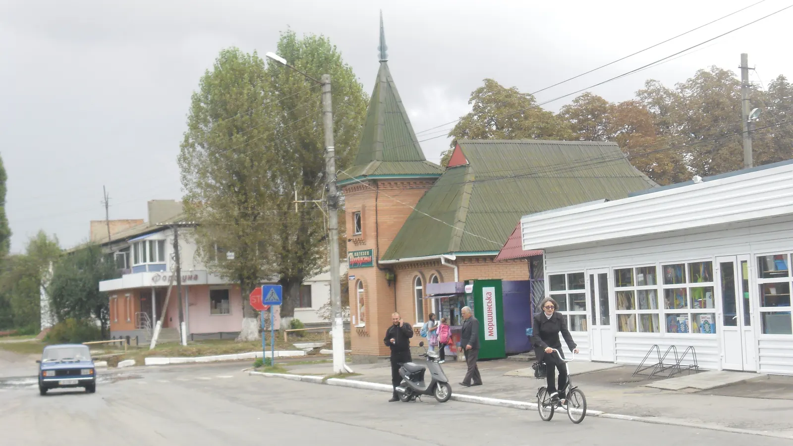 A view of Varva, with buildings and trees along a street